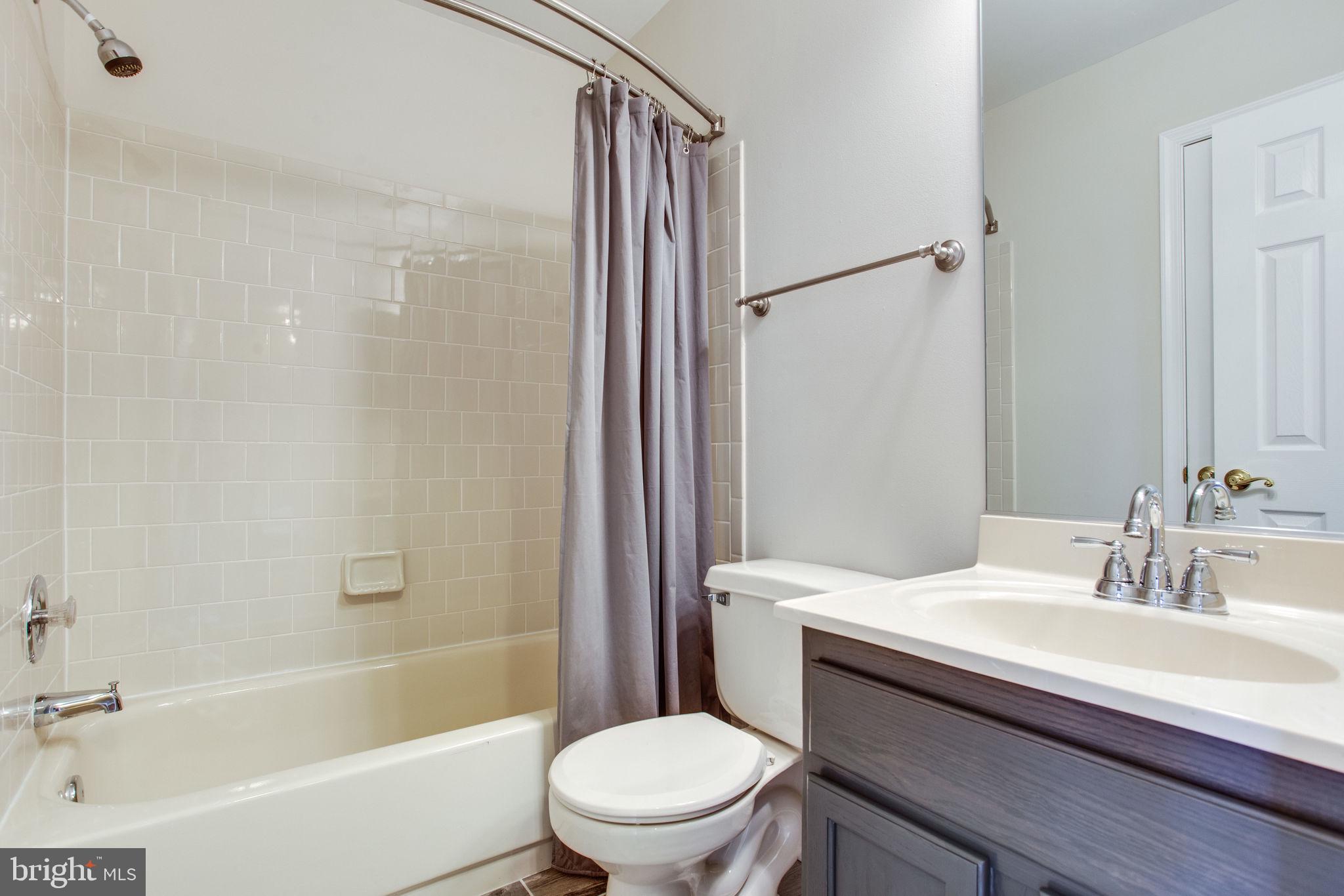 6121 Baldridge Circle Frederick, MD 21701 - Photo 36 of 60 a bathroom with a sink toilet and shower
