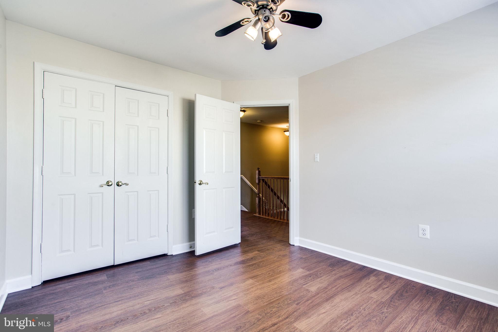 6121 Baldridge Circle Frederick, MD 21701 - Photo 39 of 60 a view of empty room with wooden floor