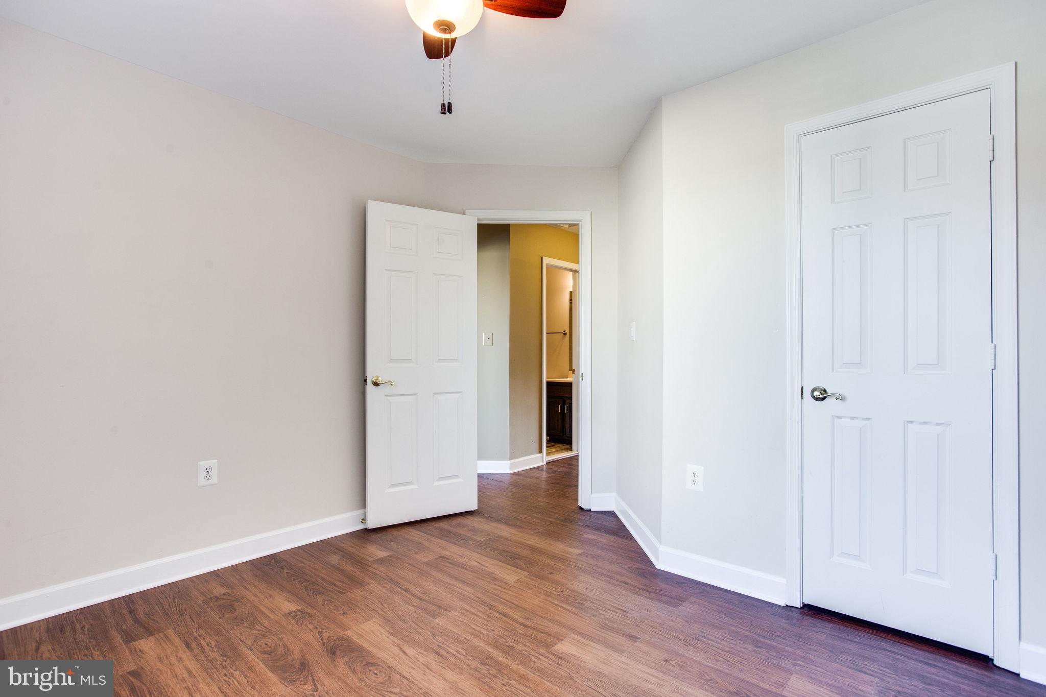 6121 Baldridge Circle Frederick, MD 21701 - Photo 42 of 60 a view of an empty room with wooden floor