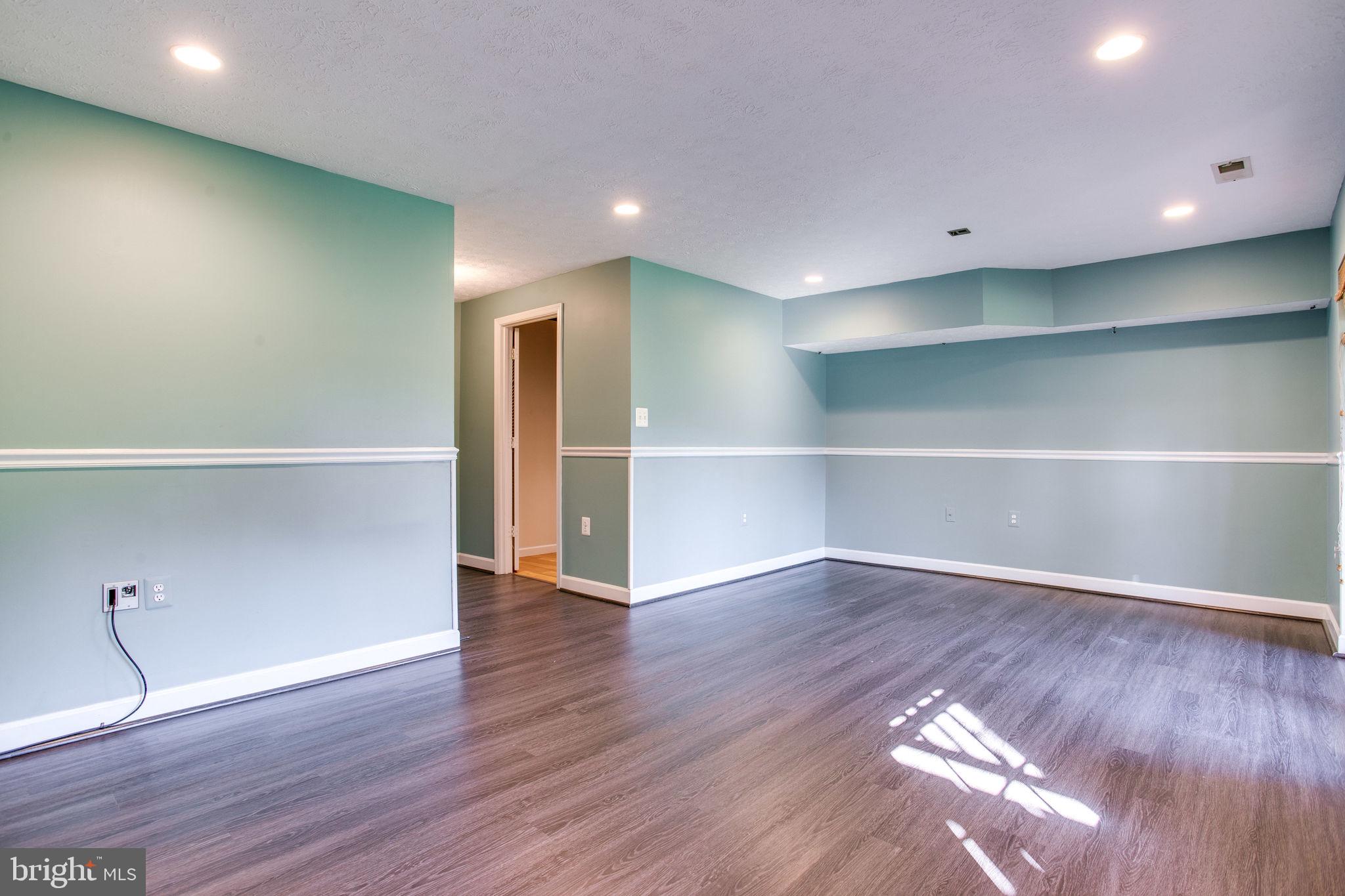 6121 Baldridge Circle Frederick, MD 21701 - Photo 45 of 60 a view of an empty room with wooden floor and closet