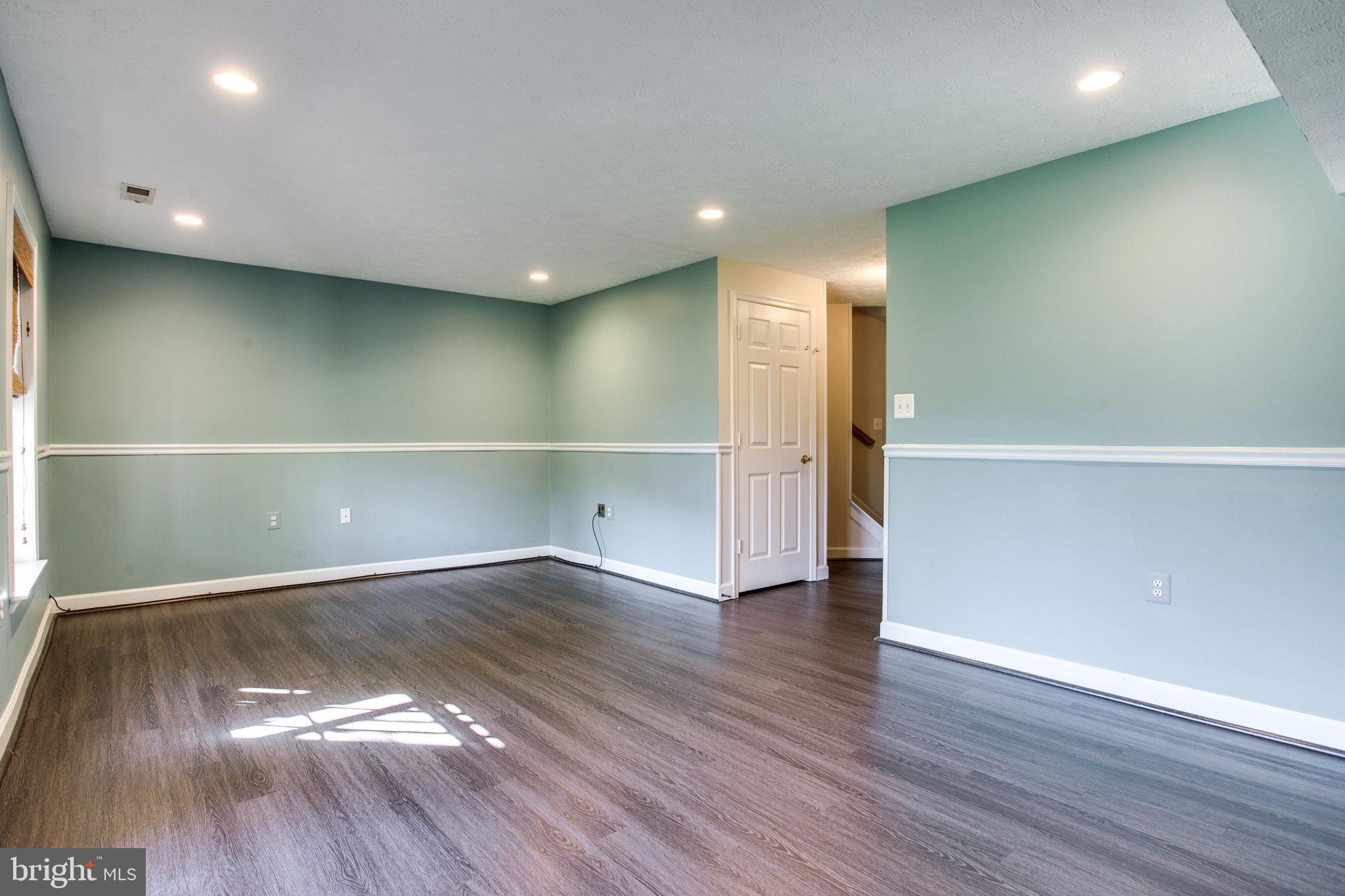 6121 Baldridge Circle Frederick, MD 21701 - Photo 46 of 60 a view of an empty room with wooden floor