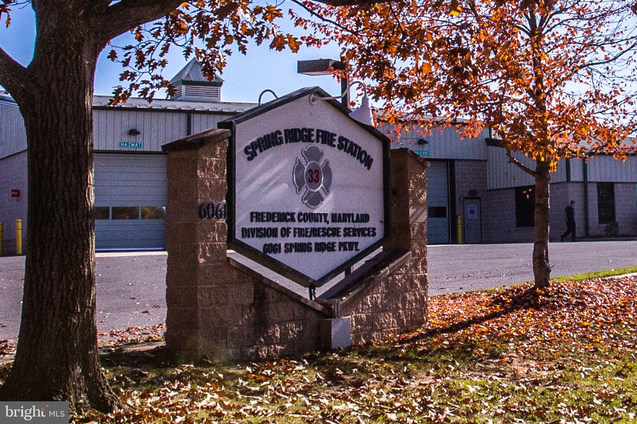 6121 Baldridge Circle Frederick, MD 21701 - Photo 58 of 60 a sign board with a small yard and a large tree