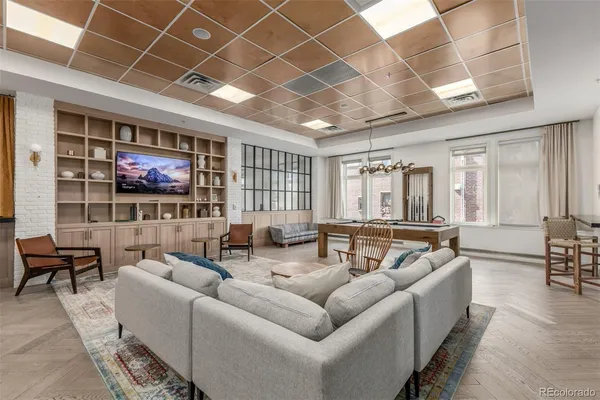 a living room with furniture and windows