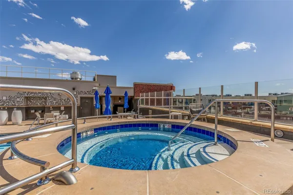 a view of a swimming pool with a lounge chairs