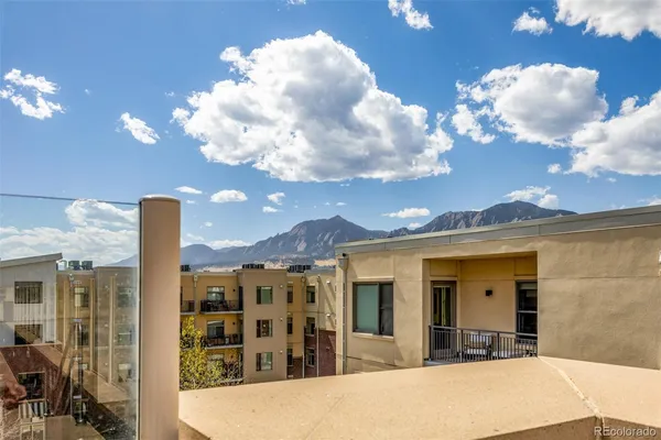 a view of a balcony with chandelier
