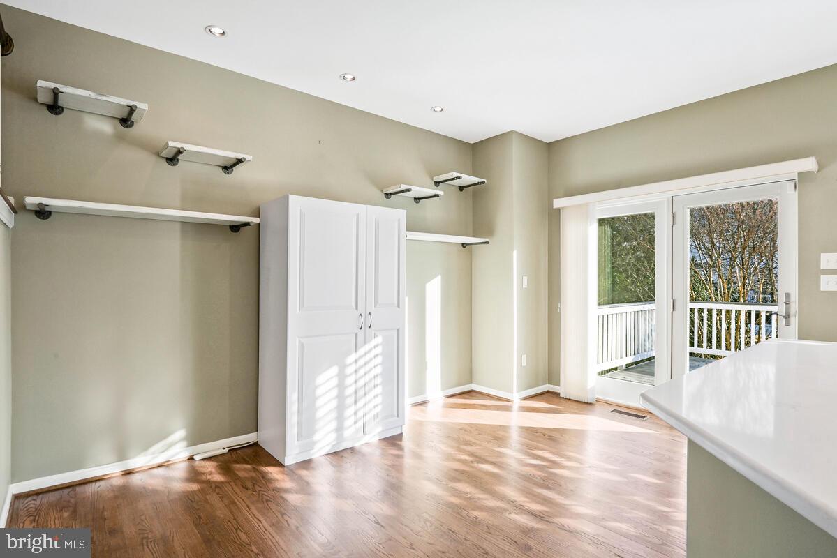 12025 Edgemere Circle Reston, VA 20190 - Photo 13 of 37 a view of a livingroom with wooden floor and window