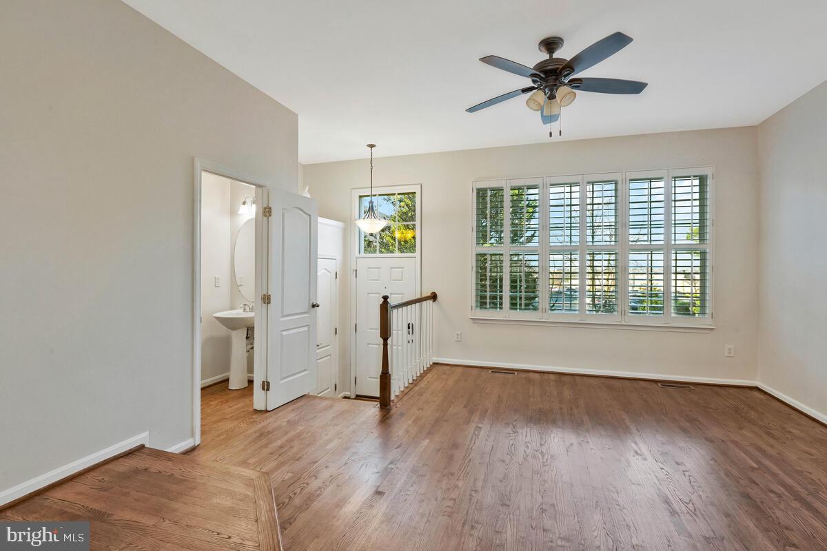 12025 Edgemere Circle Reston, VA 20190 - Photo 2 of 37 a view of empty room with wooden floor and fan