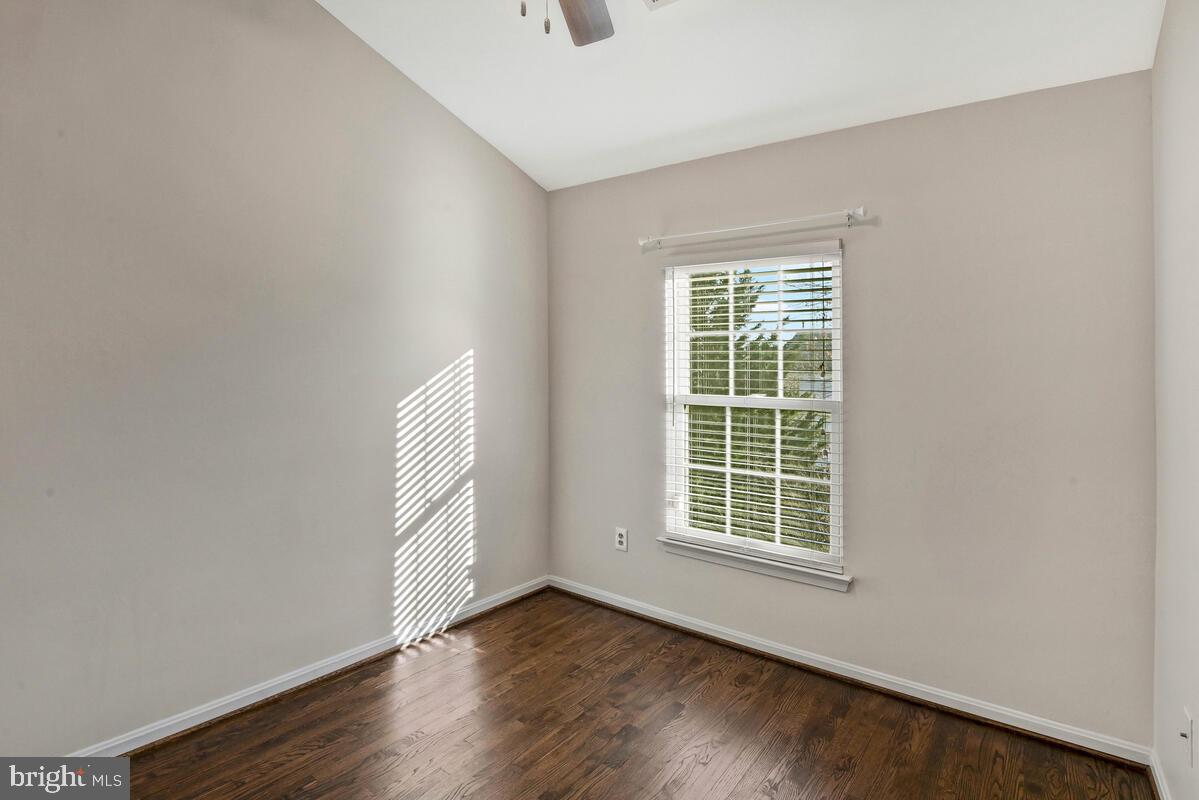 12025 Edgemere Circle Reston, VA 20190 - Photo 25 of 37 a view of an empty room with wooden floor and fan