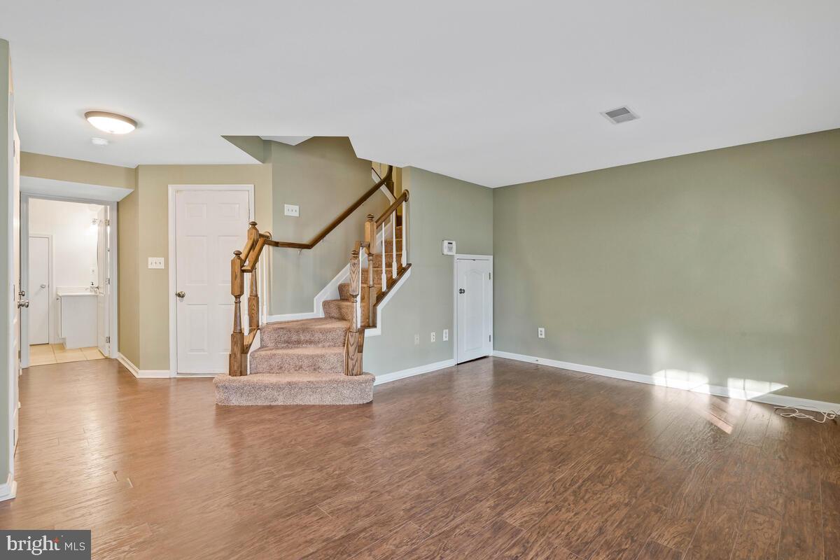 12025 Edgemere Circle Reston, VA 20190 - Photo 28 of 37 a view of entryway and hall with wooden floor