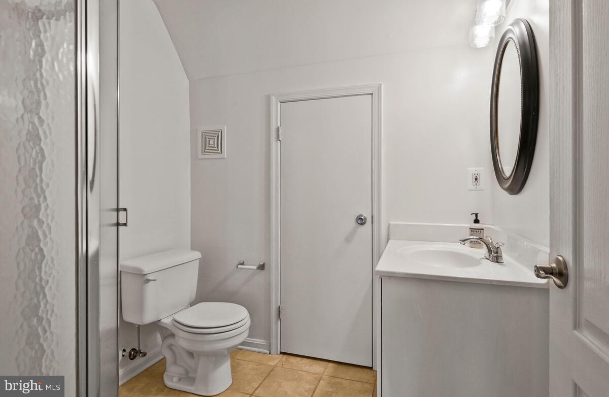 12025 Edgemere Circle Reston, VA 20190 - Photo 33 of 37 a bathroom with a toilet sink and mirror