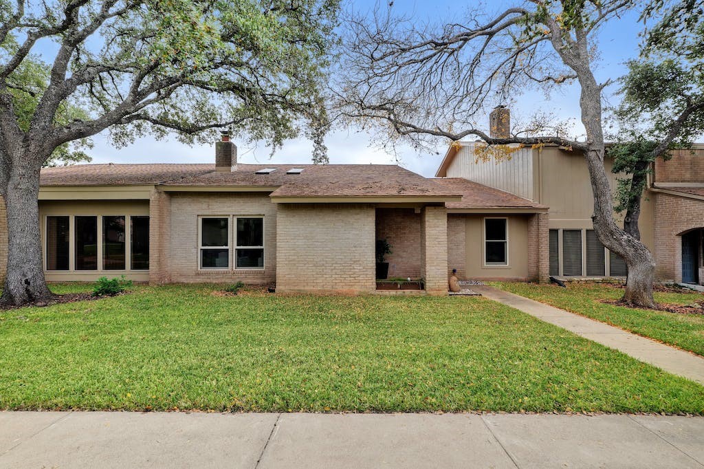 8104 Middle Court Austin, TX 78759 - Photo 1 of 1 a front view of a house with a garden