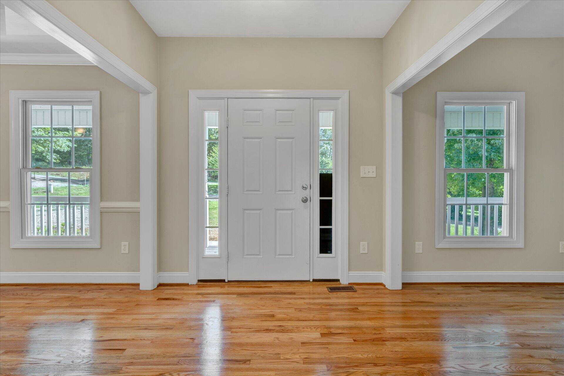 5295 Horseshoe Bend Road Goodview, VA 24095 - Photo 3 of 35 a view of an empty room with window and wooden floor