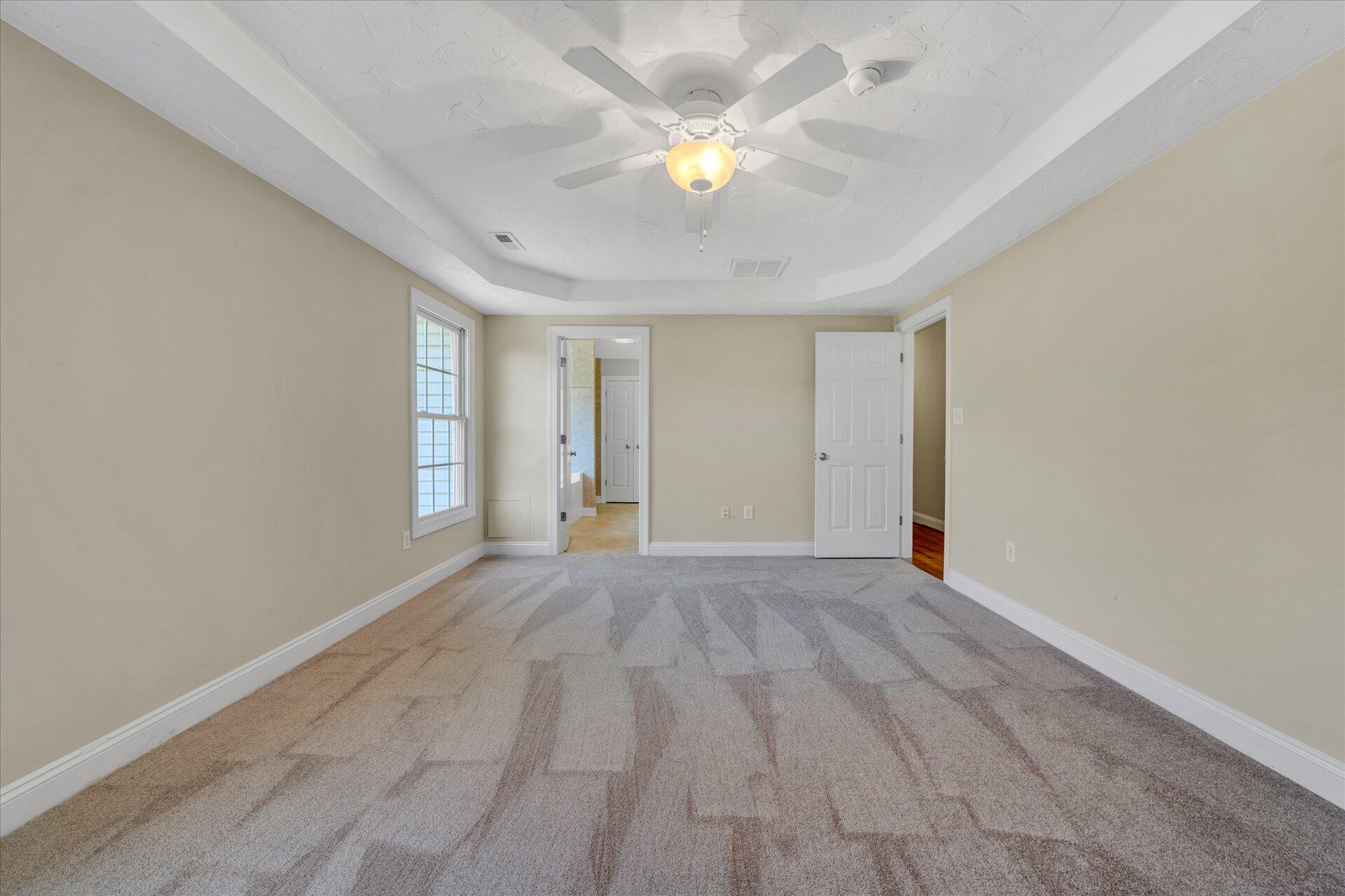 5295 Horseshoe Bend Road Goodview, VA 24095 - Photo 22 of 35 wooden floor in an empty room with a window