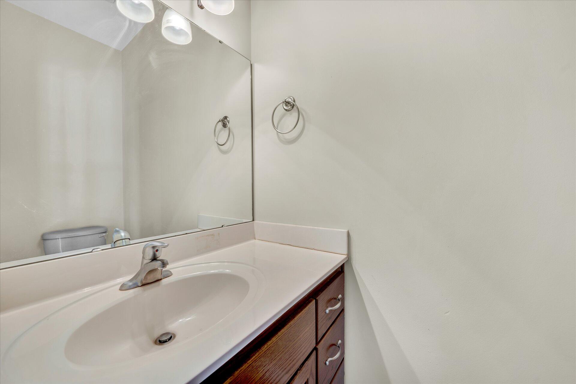 5295 Horseshoe Bend Road Goodview, VA 24095 - Photo 8 of 35 a bathroom with a sink and a mirror