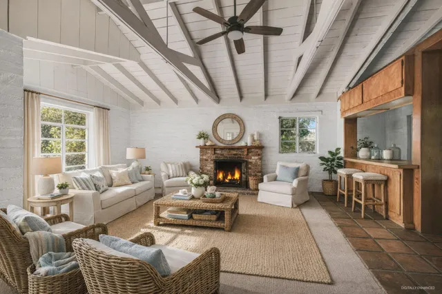 a view of an empty room with a fireplace and a window
