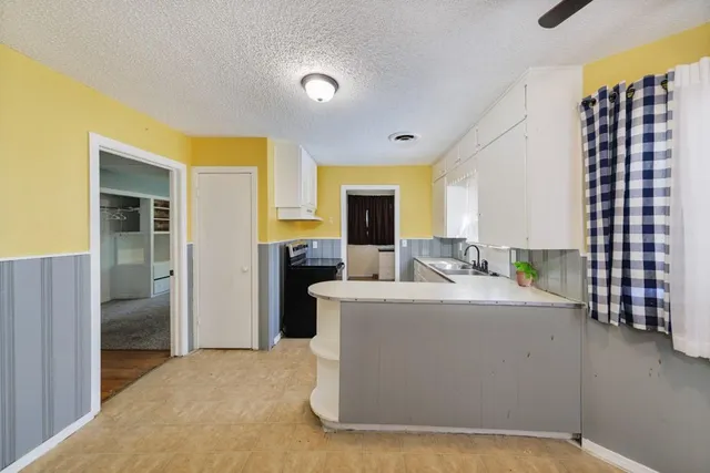 a living room with a couch and a flat screen tv