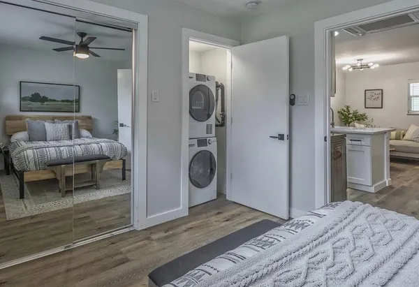 a bedroom with a bed and a chandelier
