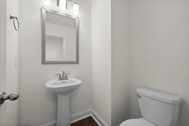 a bathroom with a sink toilet