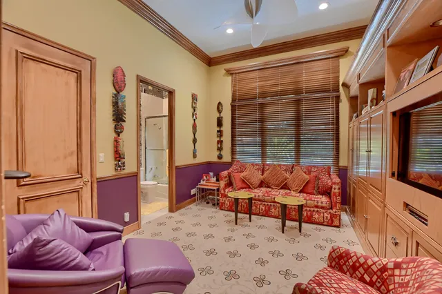 a bathroom with a granite countertop toilet sink and mirror