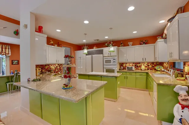 a living room filled with furniture and a floor to ceiling window