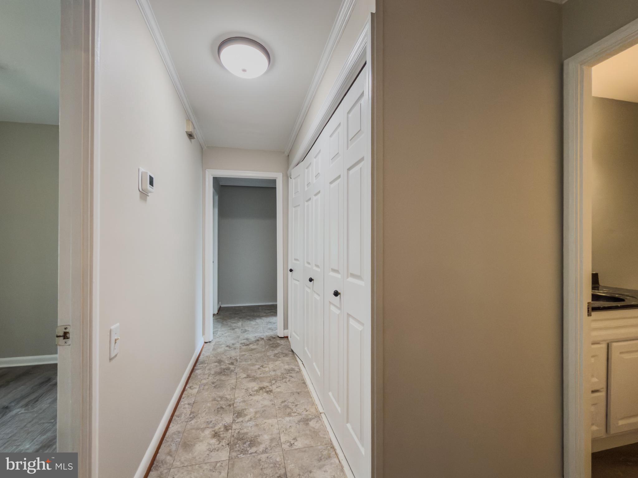 14900 Hydrus Road Silver Spring, MD 20906 - Photo 13 of 30 Bright and inviting hallway space.