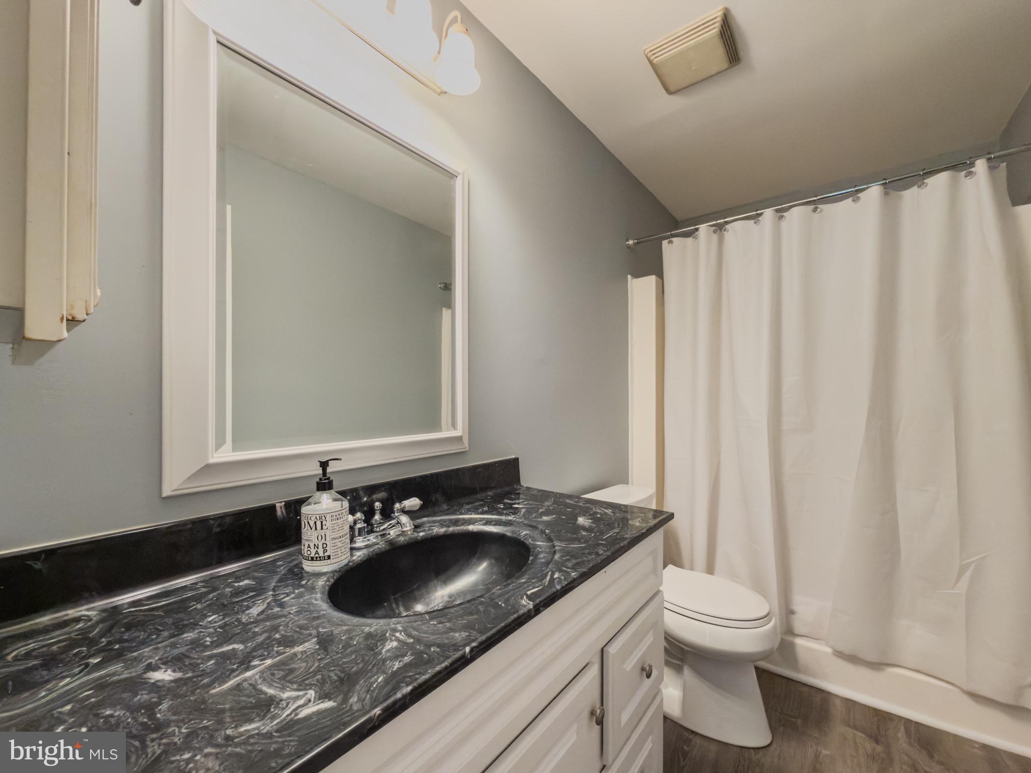 14900 Hydrus Road Silver Spring, MD 20906 - Photo 14 of 30 Charming bathroom with modern touches.