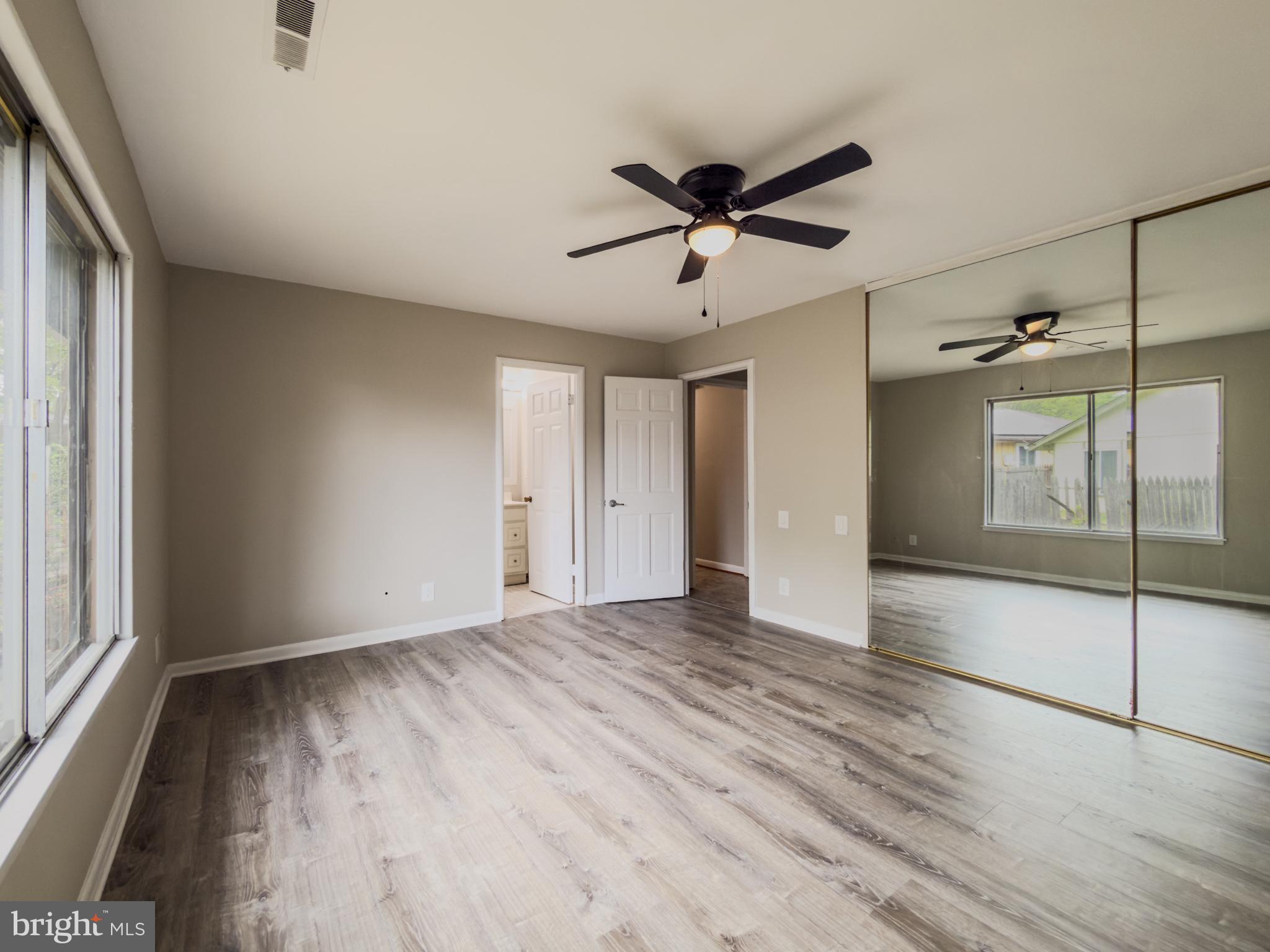 14900 Hydrus Road Silver Spring, MD 20906 - Photo 21 of 30 Spacious room with mirrored accents.