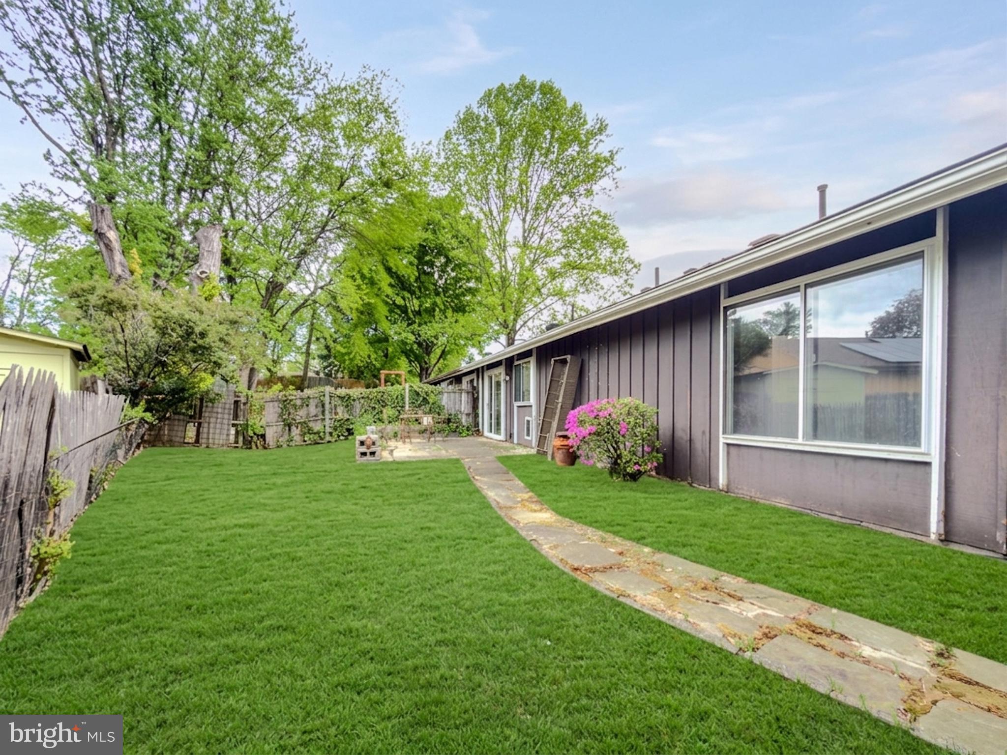 14900 Hydrus Road Silver Spring, MD 20906 - Photo 24 of 30 Lush green yard with stone pathway.