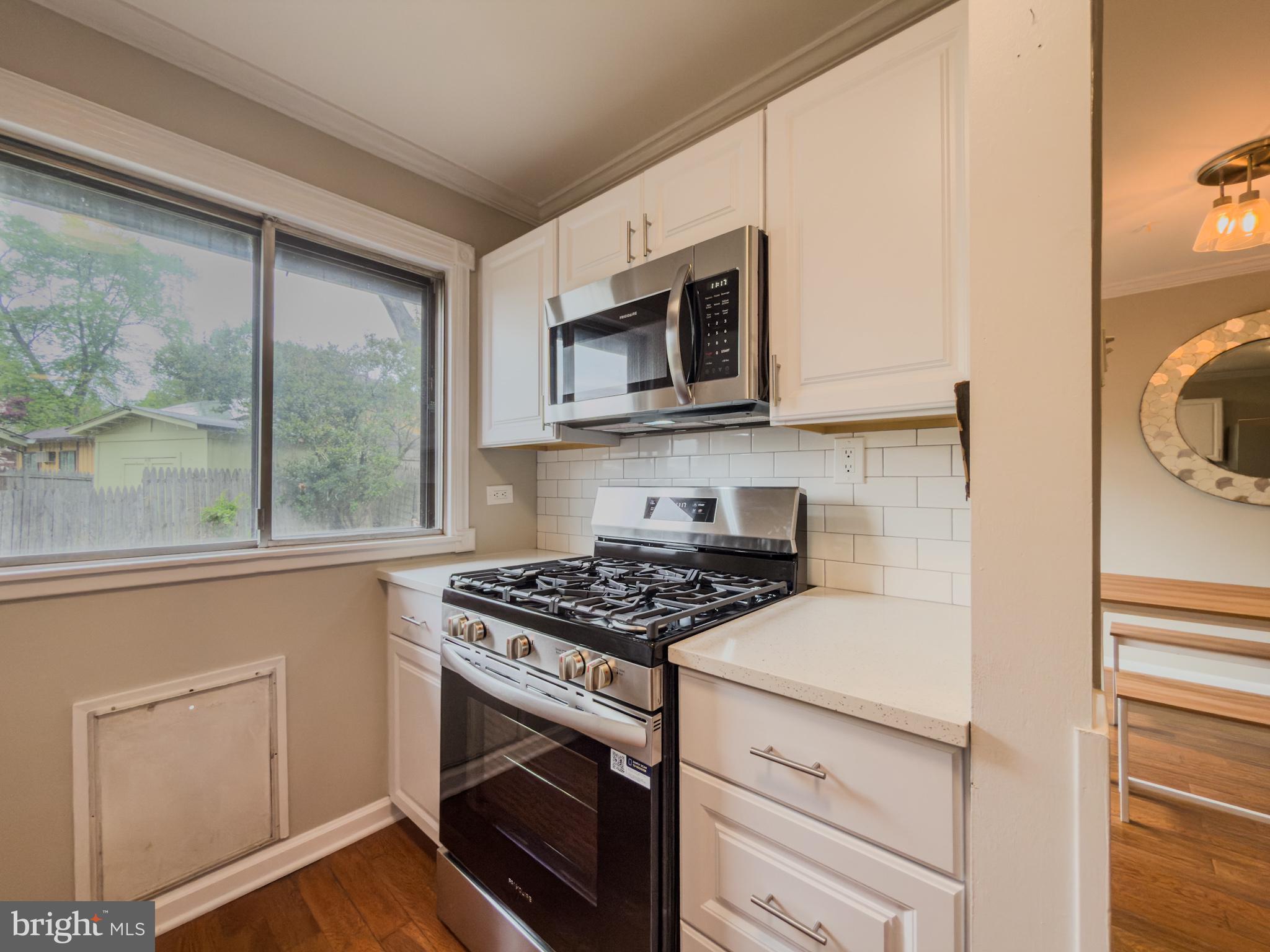 14900 Hydrus Road Silver Spring, MD 20906 - Photo 3 of 30 Modern kitchen with natural light.