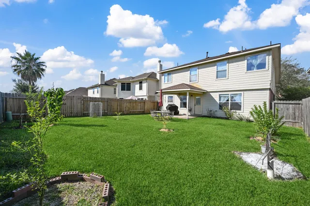 a front view of house with yard and outdoor seating