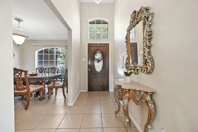 a view of dining room with furniture and chandelier