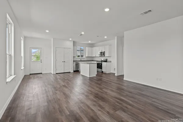 a view of kitchen with wooden floor