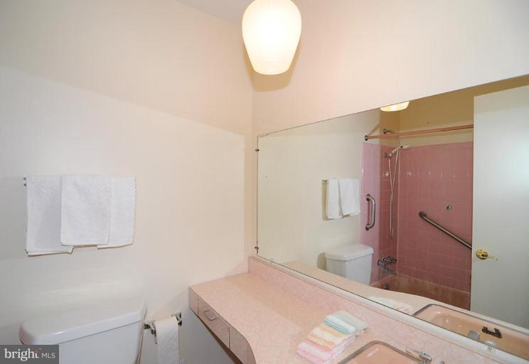 417 Waterford Road Silver Spring, MD 20901 - Photo 14 of 25 a bathroom with a sink and a mirror