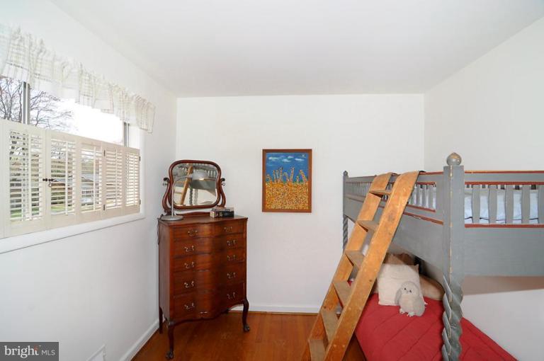 417 Waterford Road Silver Spring, MD 20901 - Photo 7 of 25 a view of walk in closet with clothes and shoes