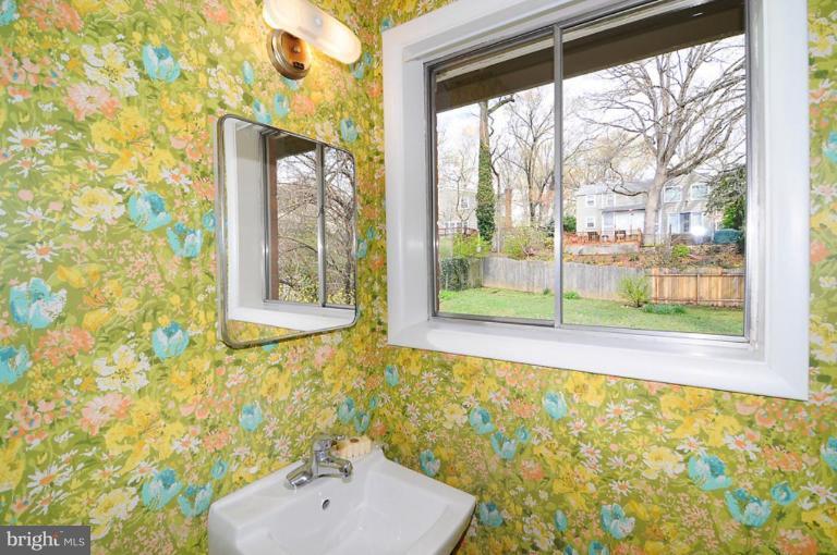 417 Waterford Road Silver Spring, MD 20901 - Photo 9 of 25 a bathroom with a sink and a large mirror