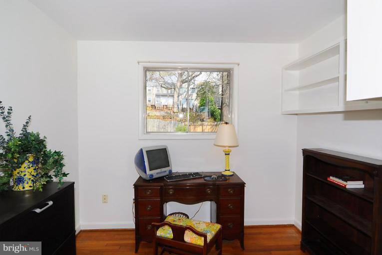 417 Waterford Road Silver Spring, MD 20901 - Photo 10 of 25 a living room with furniture and a fireplace