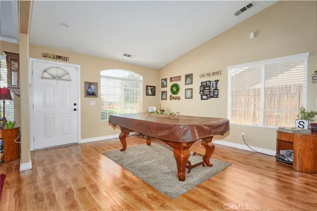 a living room with a table and a window