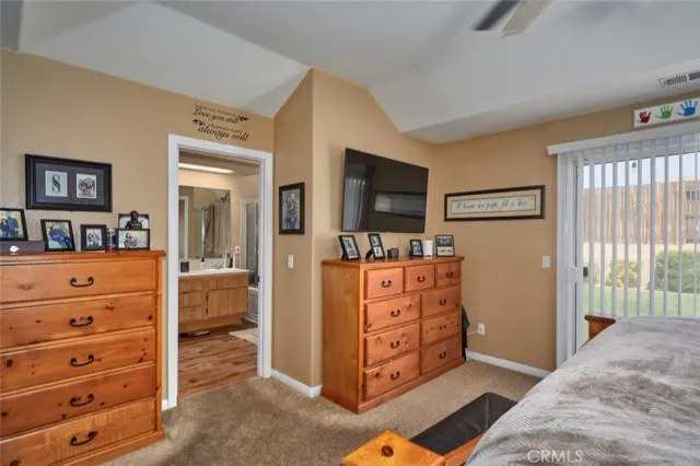 a bed room with a bed and a television