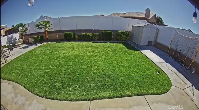 a view of a backyard with potted plants