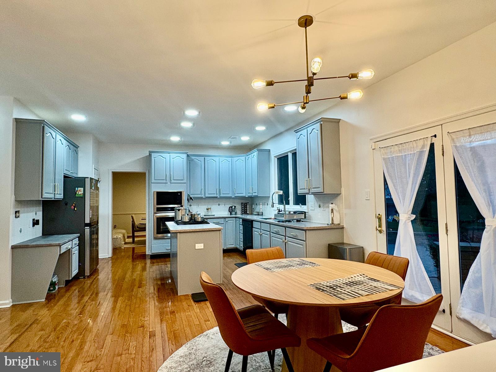 5 Murray Road Moorestown, NJ 08057 - Photo 26 of 55 a kitchen with a dining table chairs stainless steel appliances and cabinets