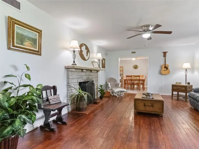 a living room with furniture and a fireplace