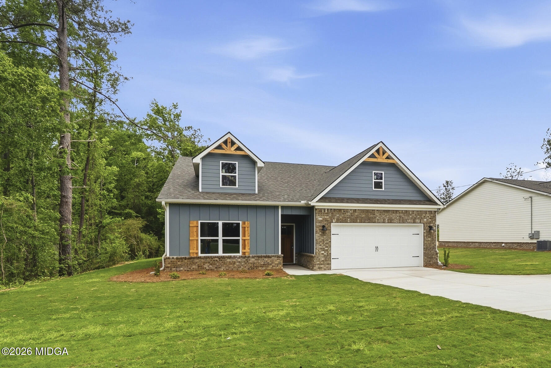 146 Overland Way Gray, GA 31032 - Photo 1 of 38 a front view of a house with a yard and garage
