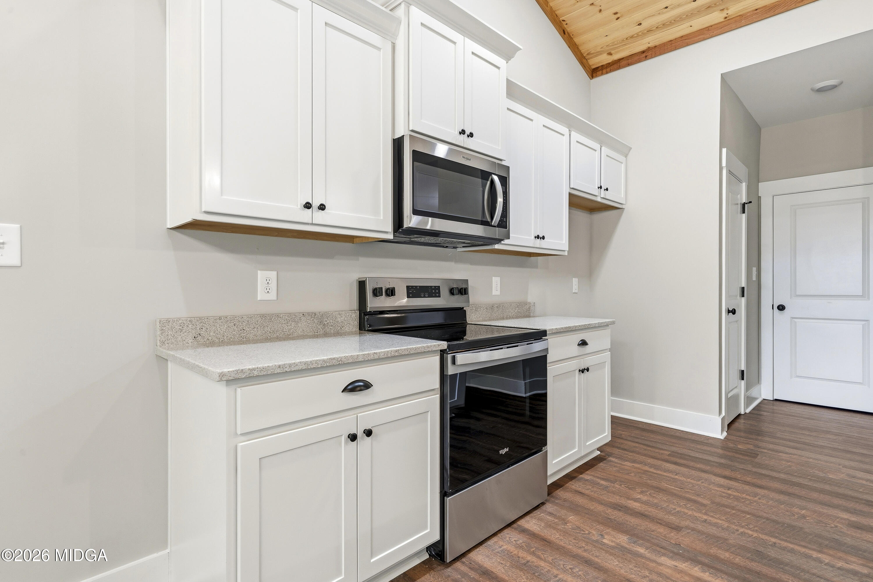 146 Overland Way Gray, GA 31032 - Photo 12 of 38 a kitchen with stainless steel appliances granite countertop a stove a microwave and a refrigerator