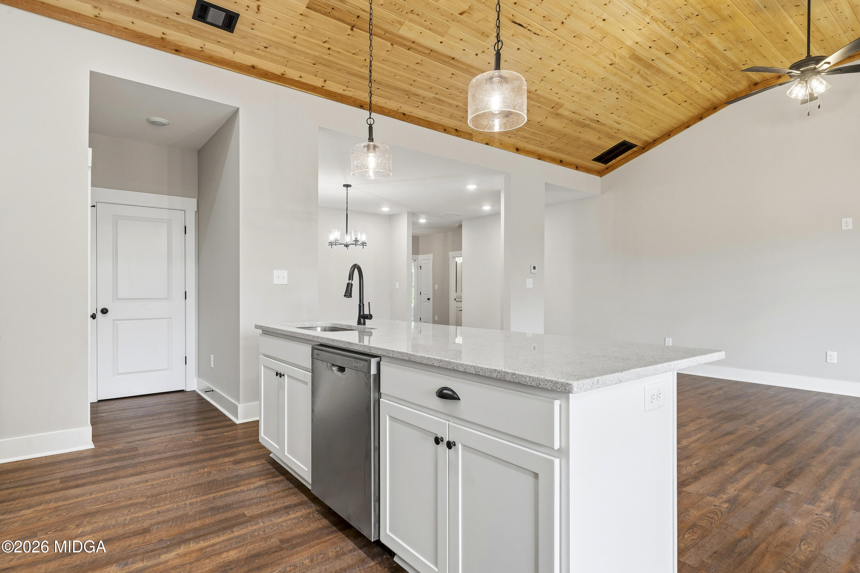 146 Overland Way Gray, GA 31032 - Photo 13 of 38 a large kitchen with a large counter top space a sink and stainless steel appliances