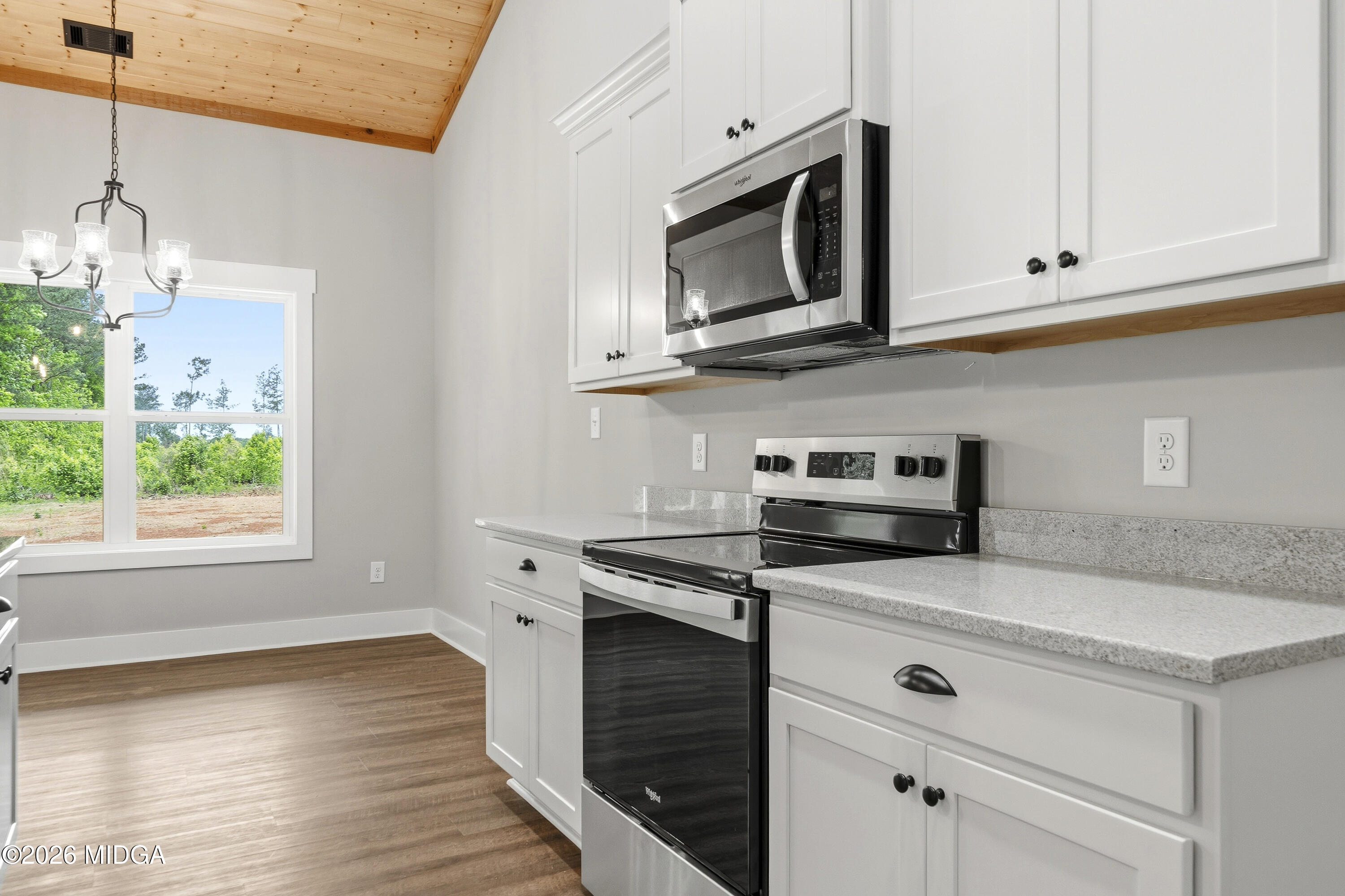 146 Overland Way Gray, GA 31032 - Photo 15 of 38 a kitchen with granite countertop white cabinets appliances a window and a sink