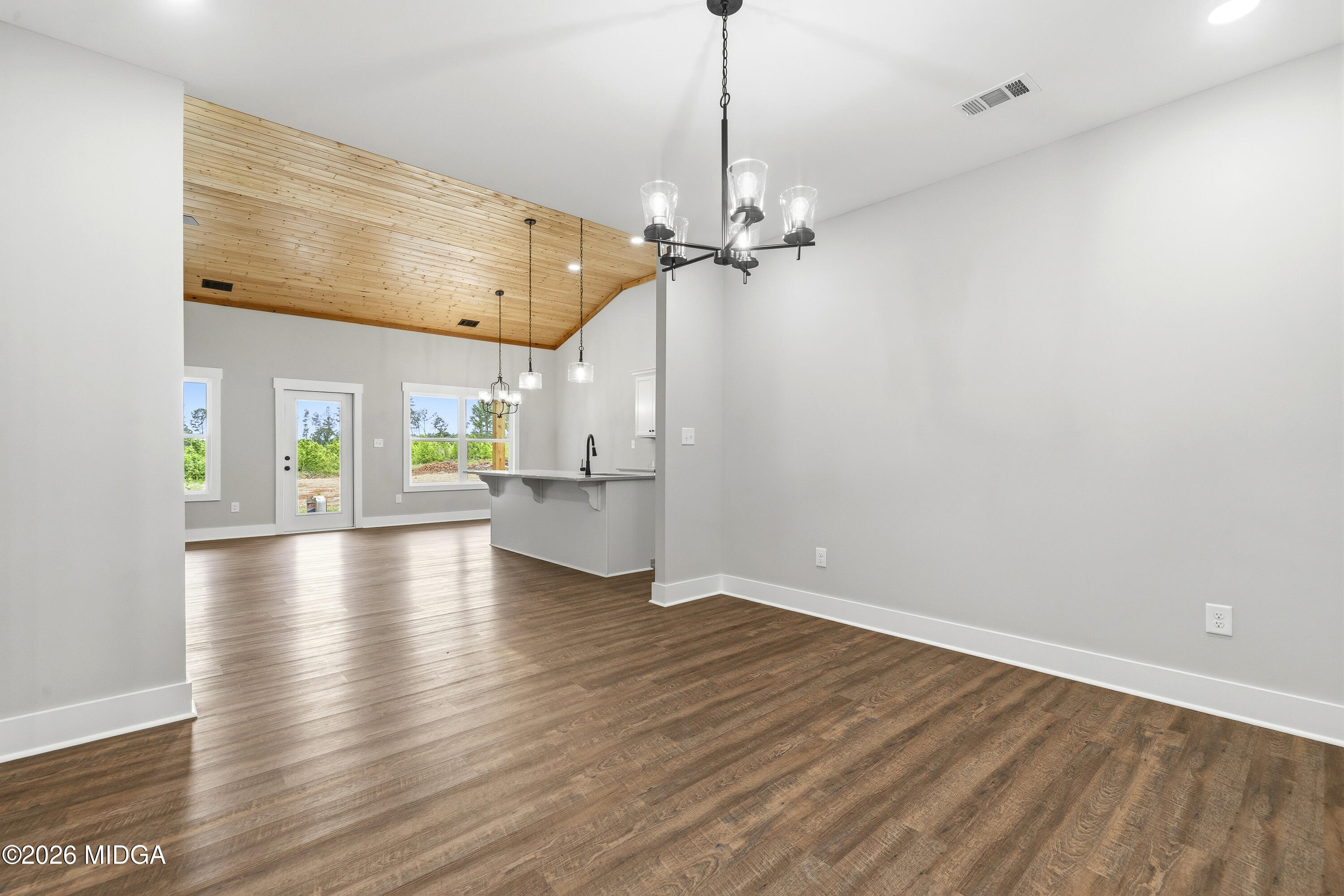 146 Overland Way Gray, GA 31032 - Photo 19 of 38 a view of a room with wooden floor ceiling fan and windows