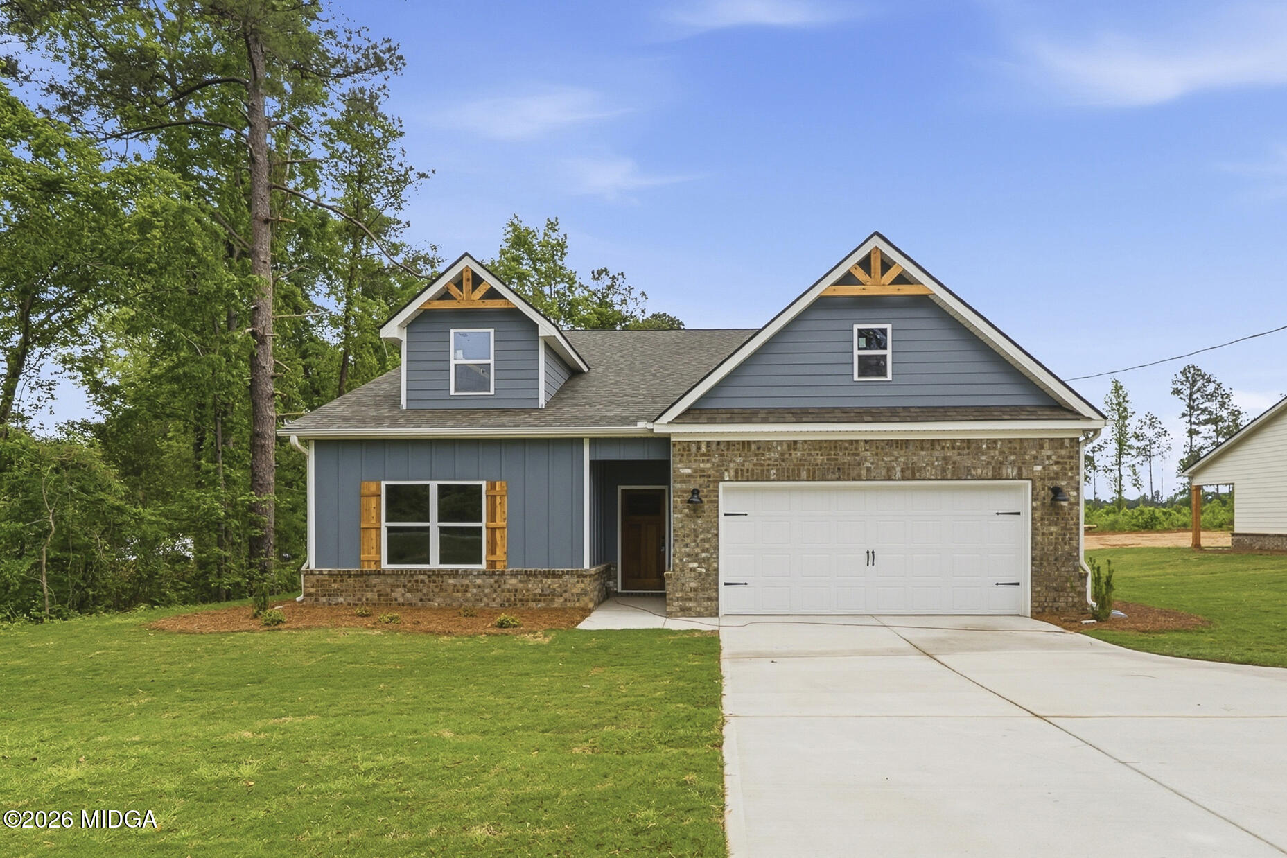 146 Overland Way Gray, GA 31032 - Photo 2 of 38 a front view of a house with a yard