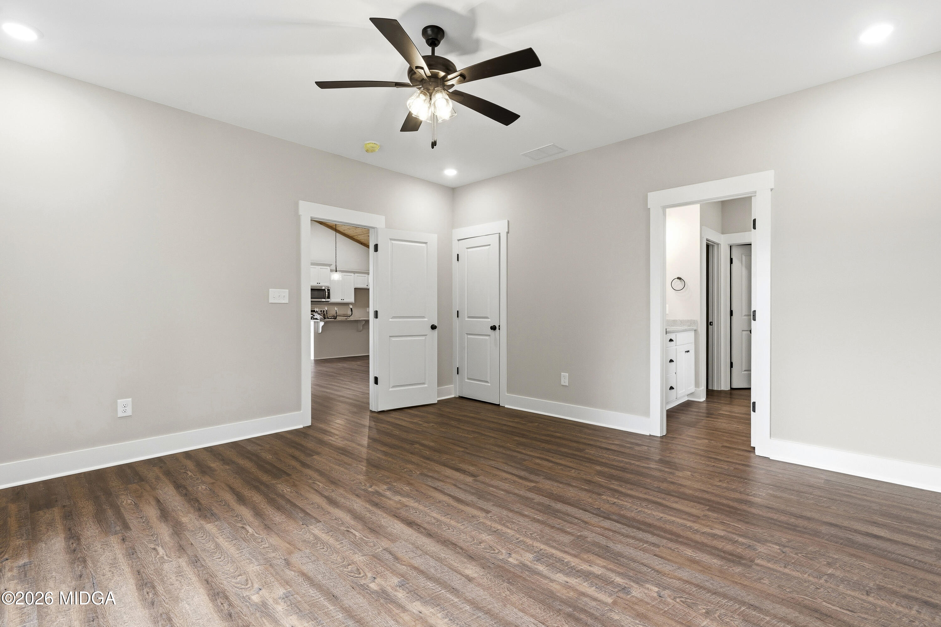 146 Overland Way Gray, GA 31032 - Photo 23 of 38 an empty room with wooden floor and a ceiling fan