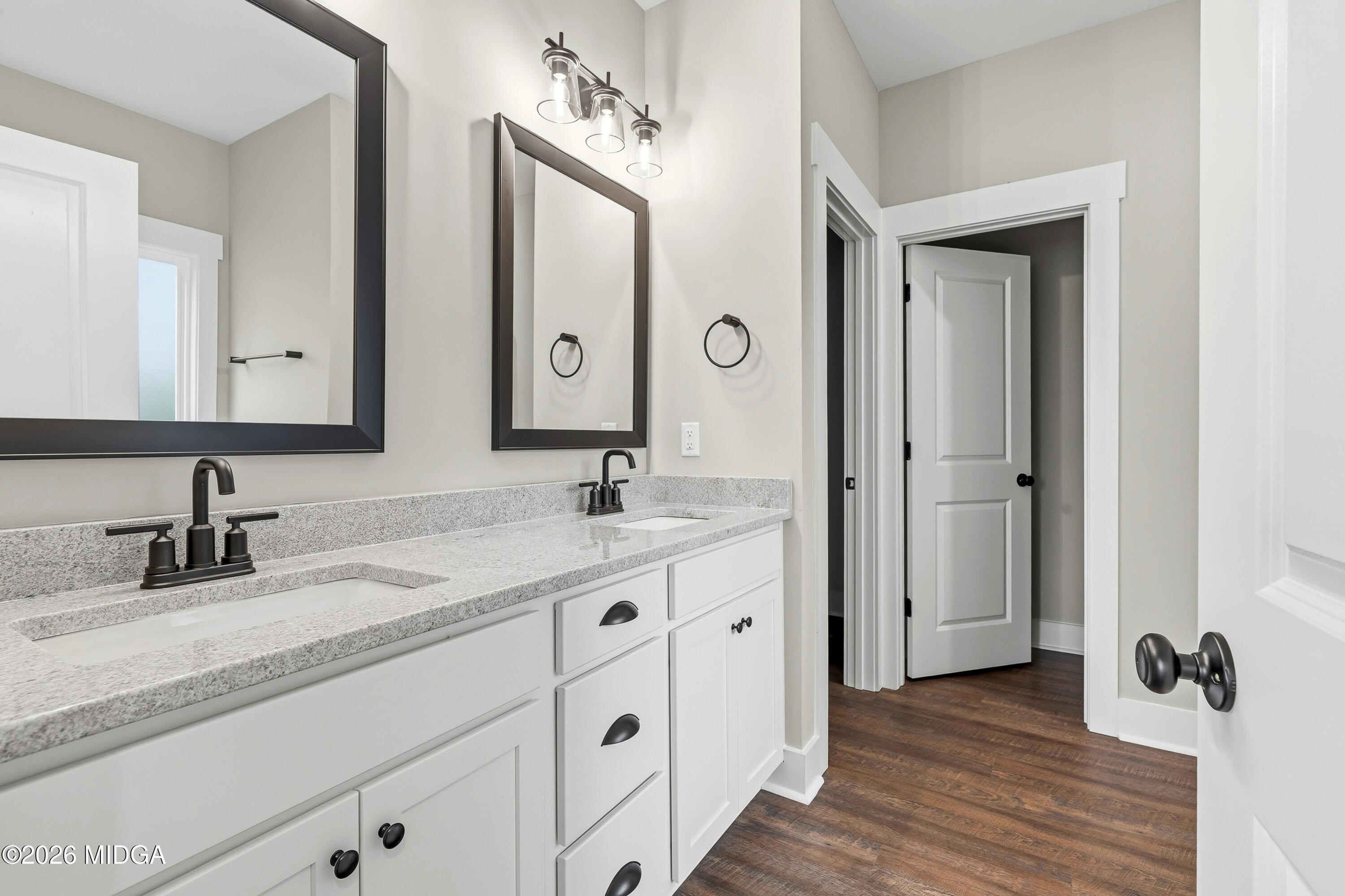146 Overland Way Gray, GA 31032 - Photo 24 of 38 a bathroom with a double vanity sink and mirror
