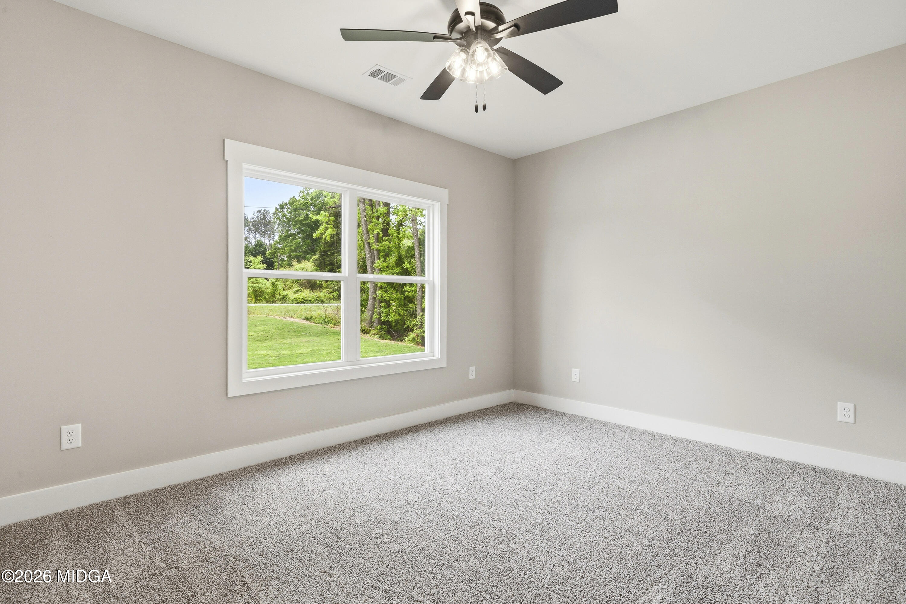 146 Overland Way Gray, GA 31032 - Photo 25 of 38 an empty room with a window and a fan